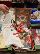 A box of Liverpool FCmemorabilia to include t-shirt, flags, figure, mirror, annuals, dvds, vhs...