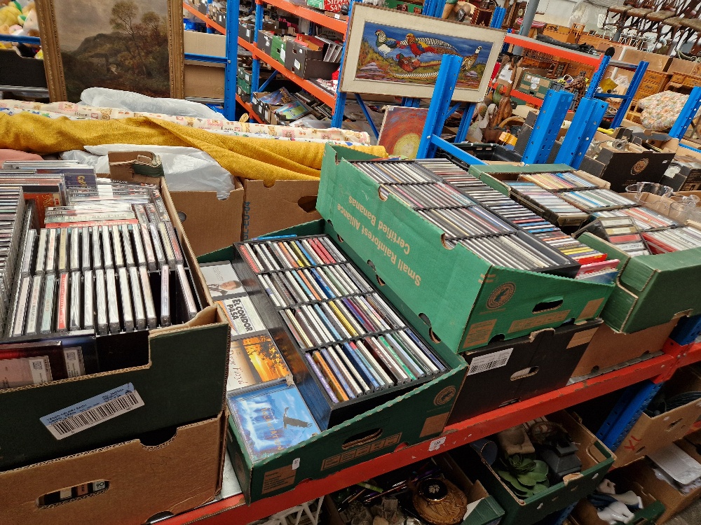 Seven boxes of CDs and cassettes.
