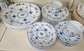 Royal Copenhagen plates, saucers and two cups