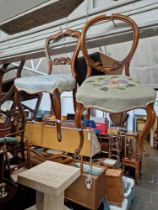 Two Victorian walnut chairs with cabriole legs.