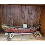 A model of a 4th Class Man-o-war c1690, made by W R Campbell, together with 2 nutcrackers in the