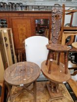 A mixed lot comprising African carved wood tables, a carved oak spinning chair and a carved hardwood