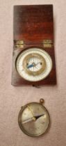 Two antique pocket compasses.