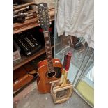 An Eko 12 string electro acoustic guitar - as found. and three vintage tennis rackets.