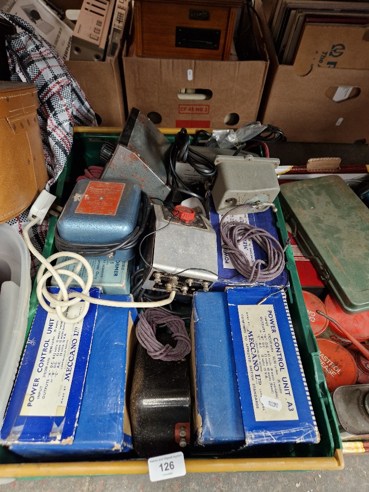 A box of power control units including Meccano.