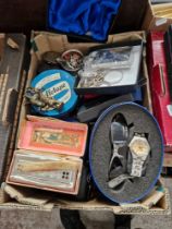 A box of assorted collectables.