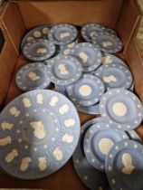 A box of mainly American themed Wedgwood jasperware plates and pin dishes.