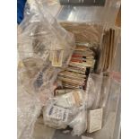 A box of assorted loose and albums of cigarette cards.