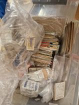 A box of assorted loose and albums of cigarette cards.