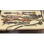 A box of vintage horse brasses