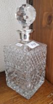 Glass decanter with silver rim