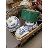 A box of assorted pottery, tins, Wedgwood platter, Churchill etc.