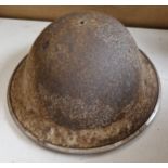 A WW2 British steel military helmet.