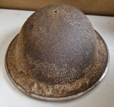 A WW2 British steel military helmet.