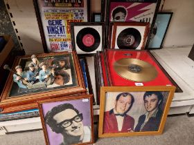 A collection of framed Rock & Roll music memorabilia including The Beatles, posters, vinyl