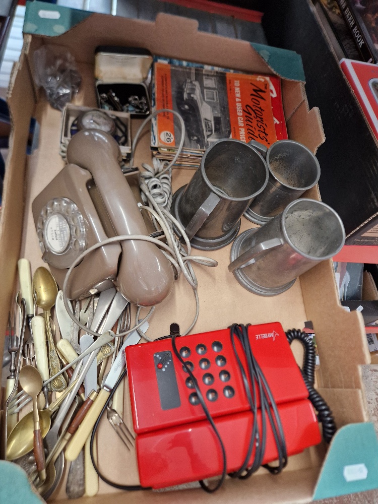 A box of assorted collectables to include pewter tankards, vintage telephones, various Boys Own