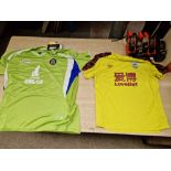 A mixed lot of football shirts (some with tags), football programmes including Liverpool FC and
