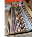 A box of country vinyl LP records and box sets.