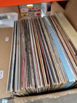 A box of country vinyl LP records and box sets.