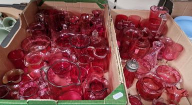 Two boxes of cranberry glass.