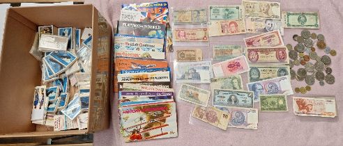 A mixed lot of collectors cards, banknotes and coins.