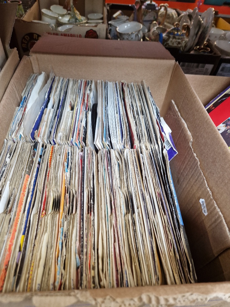 A box of mixed soul, rock & pop 7" vinyl singles.