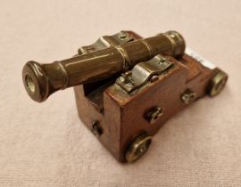 A miniature model cannon.
