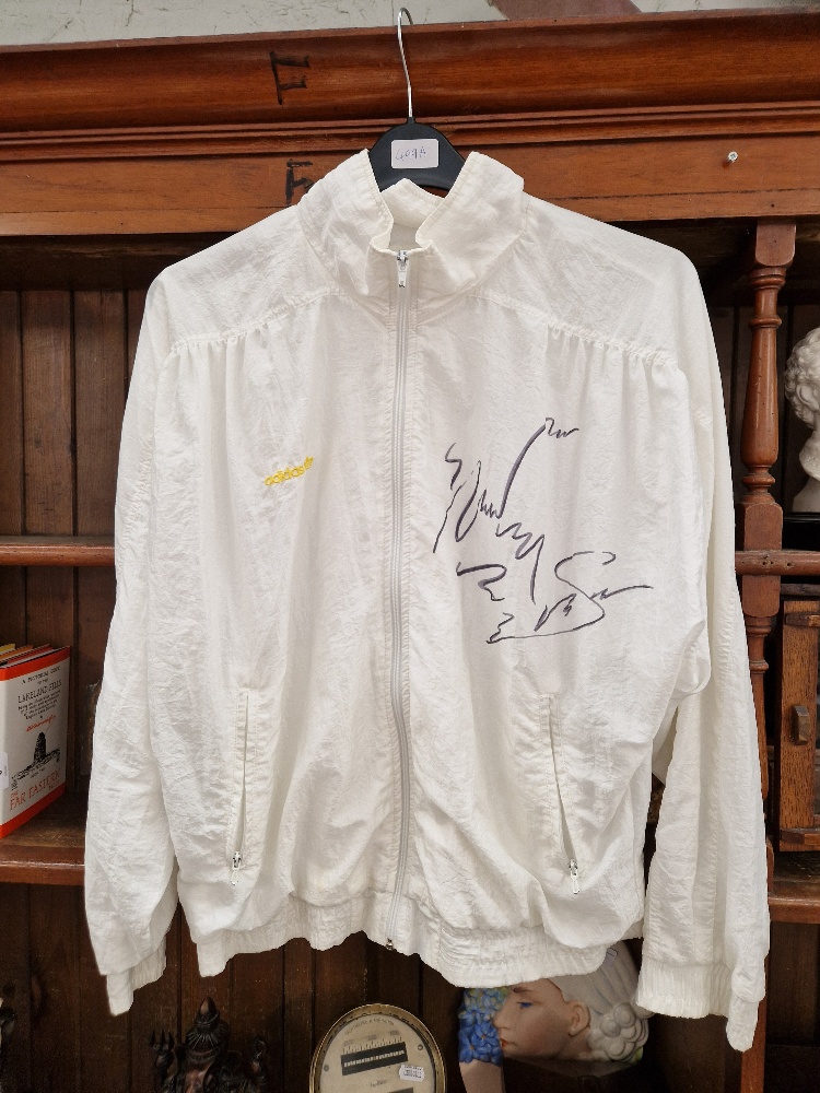 A shell suit jacket signed by Steffi Graf.