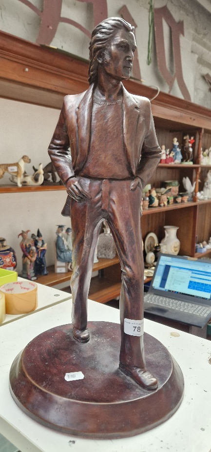 A modern sculpture depicting John Lennon by Tom Murphy, dated 2003, approx. 50cm.