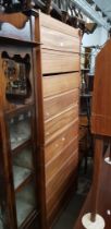 A pair of teak chest of drawers.