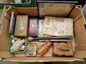 A box of assorted collectables including a treen bottle holder, a carved wood casket, war time