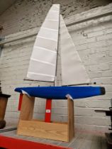 A model pond yacht on stand.