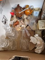 A box of assorted items including a Royal Doulton figure, glass decanters, carved wood, silver plate