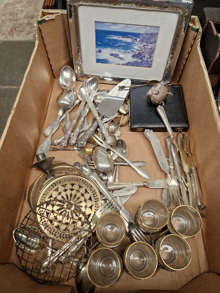 A box of assorted silver and silver plated ware.