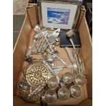 A box of assorted silver and silver plated ware.