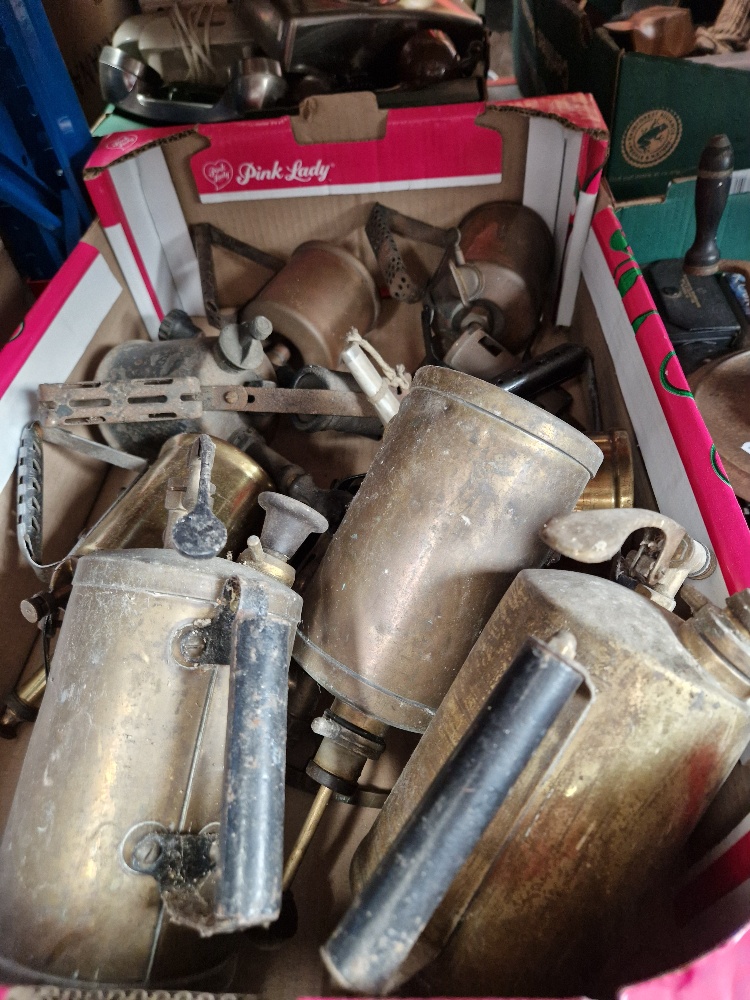 A box of vintage tools including blow lamps.