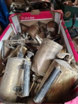 A box of vintage tools including blow lamps.