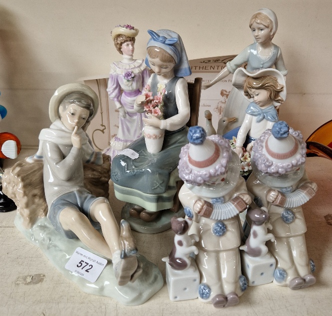 Five Lladro figures and two others
