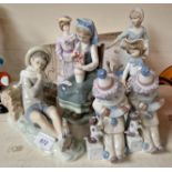 Five Lladro figures and two others