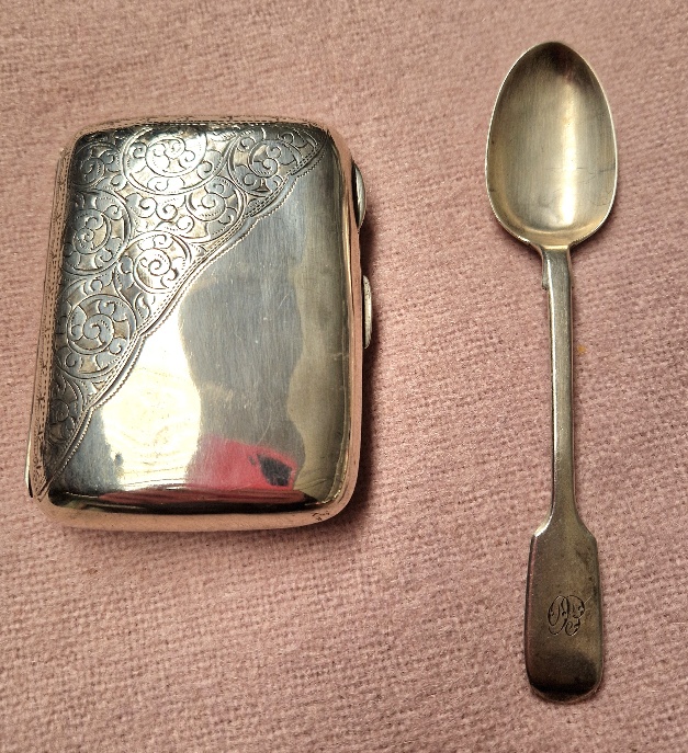 A hallmarked silver cigarette case and hallmarked silver spoon