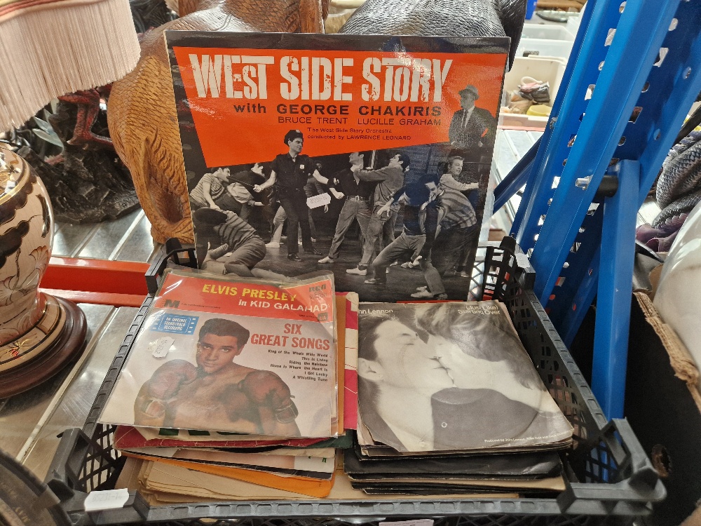 A box of mostly Elvis and Beatles 7" vinyl singles.
