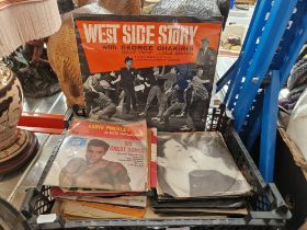 A box of mostly Elvis and Beatles 7" vinyl singles.