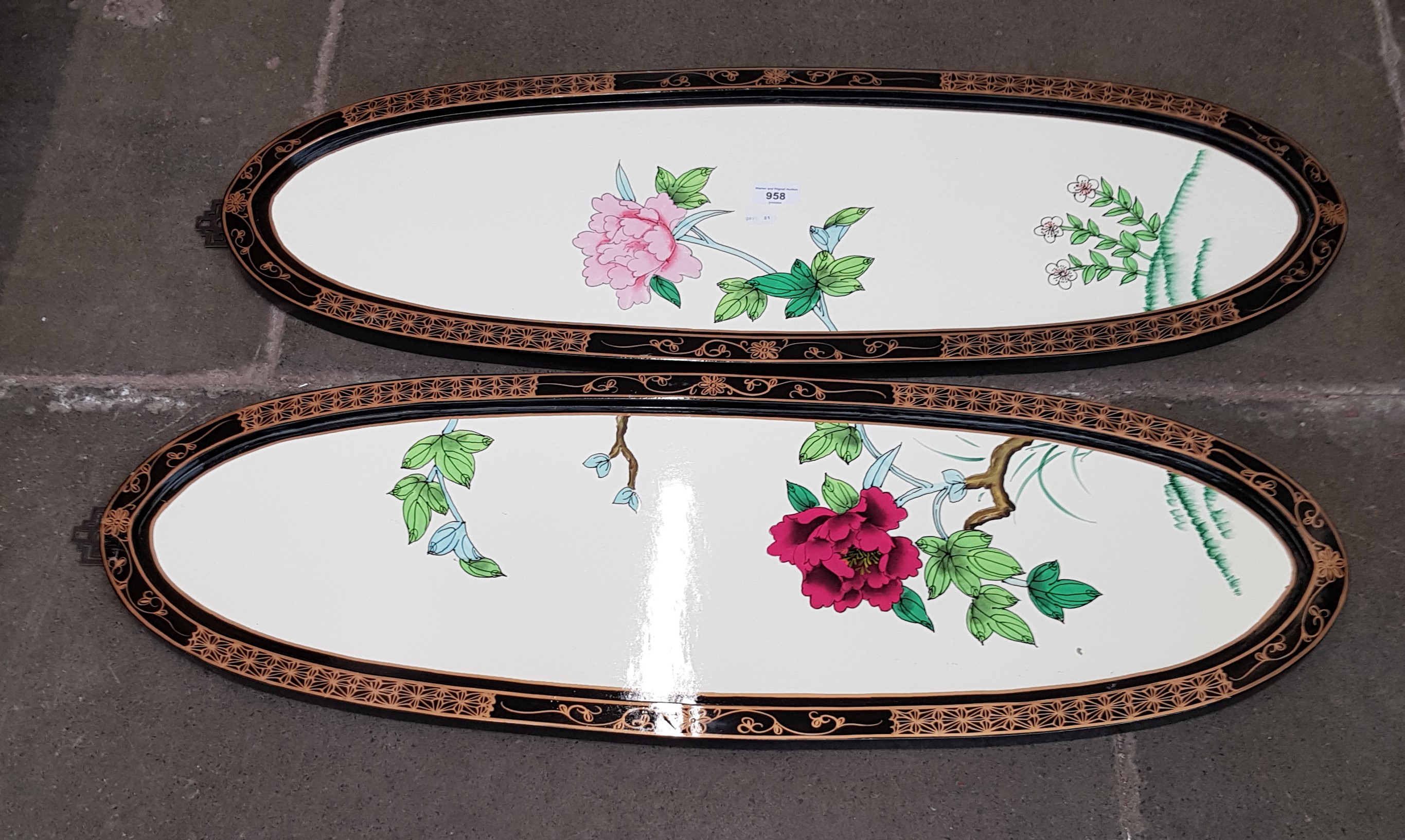 A pair of Oriental decorated panels.