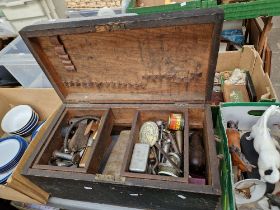 A wooden tool chest and contents.