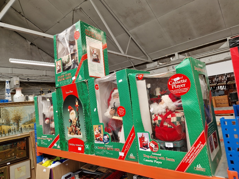 A group of five animated Father Christmas models