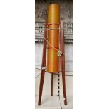 A mid century rocket lamp, teak legs, acrylic shade, 110cm height.