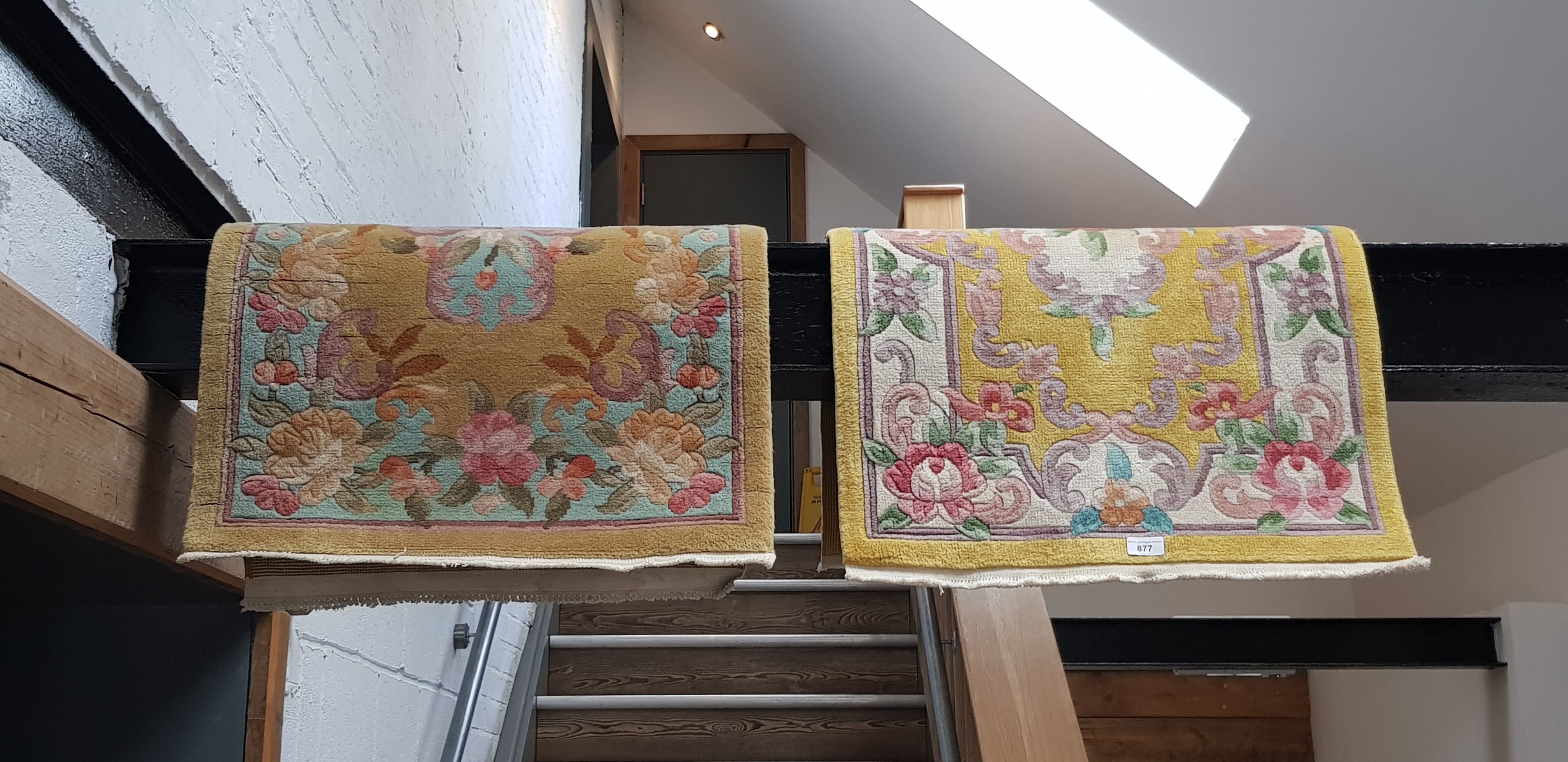 Two small Chinese wool carpets, yellow ground decorated with flowers.