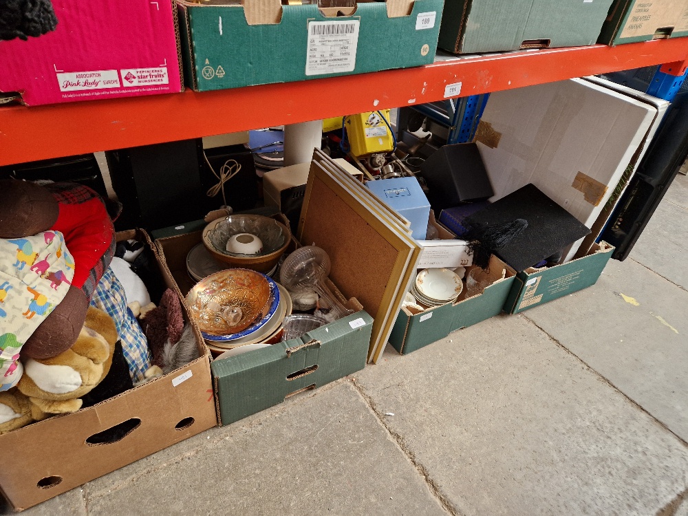 Four boxes of assorted items comprising china and glass, soft toys, cutlery etc.