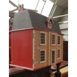 A Georgian style two storey dolls house- unfurnished. Length 72cm.