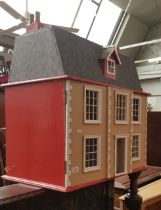 A Georgian style two storey dolls house- unfurnished. Length 72cm.